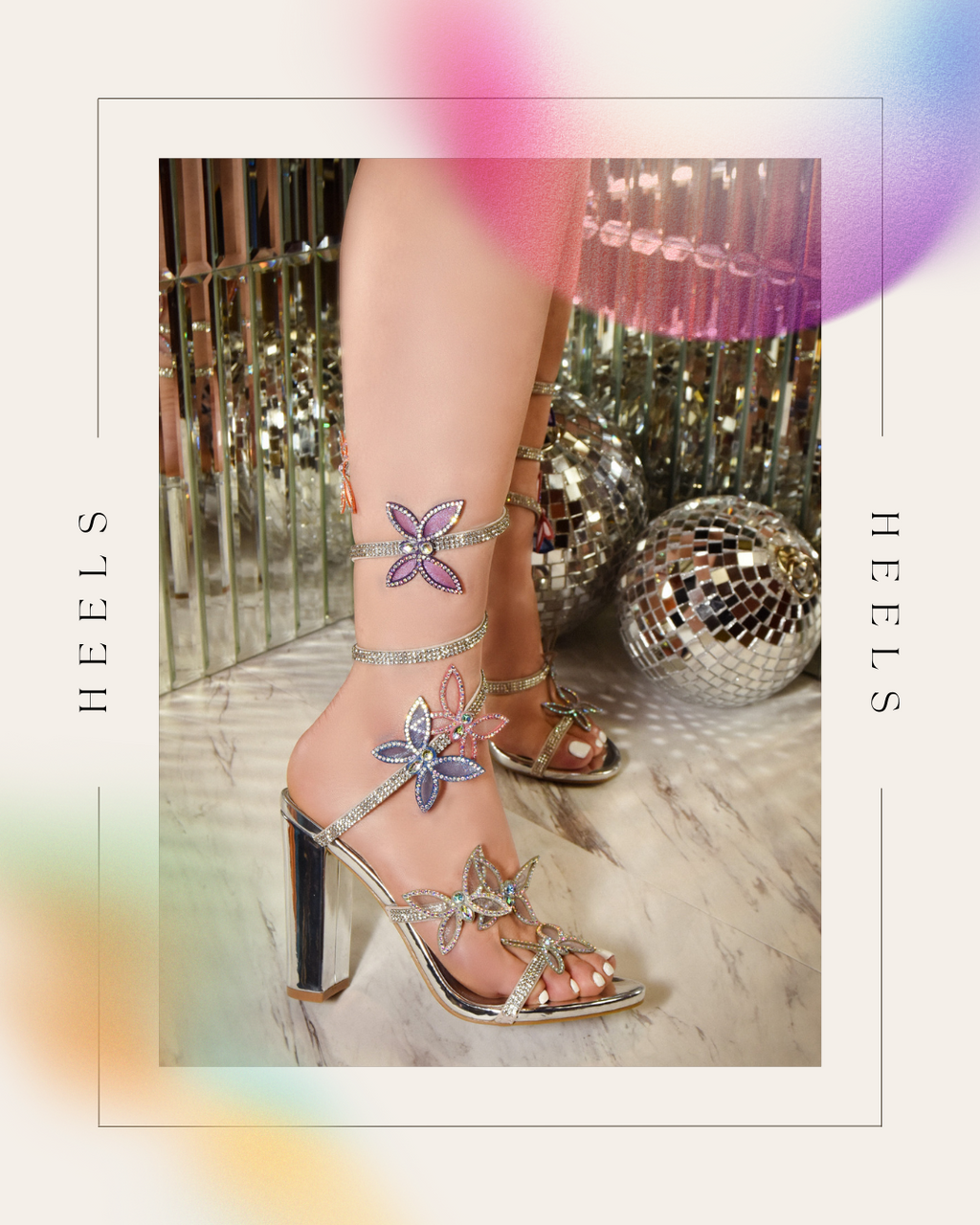 Women wearing Morris-581A Silver butterfly rainbow heels on a mirrored disco style background